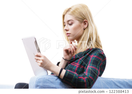 Young woman using tablet Young woman using tablet 122388413