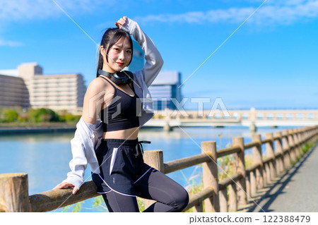 A cool woman sitting and posing while walking along the river Posing Diet Walking Exercise A cool woman sitting and posing while walking along the river Posing Diet Walking Exercise 122388479