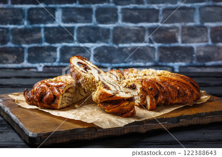 Cinnamon braided bread topped with pearl sugar 122388643
