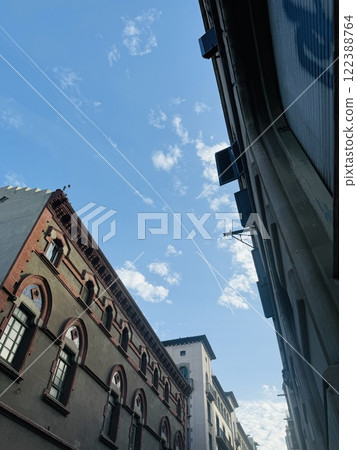 A clear sky and a faint contrail in the city of Andorra A clear sky and a faint contrail in the city of Andorra 122388764