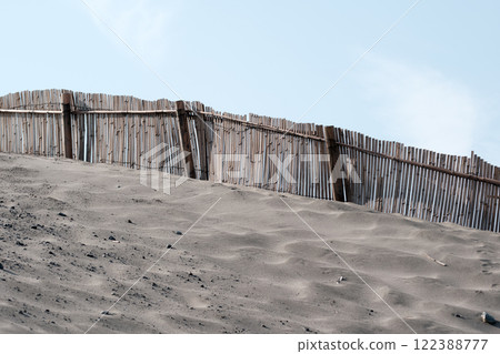 Sand fences installed to prevent sand from escaping Sand fences installed to prevent sand from escaping 122388777