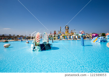 swimming pool with coconut tree and white umbrella swimming pool with coconut tree and white umbrella 122389053