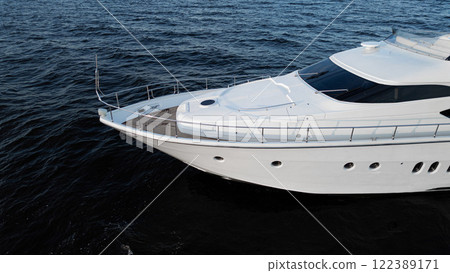 Experience a Luxury Yacht Sailing on Calm and Serene Waters, perfect for relaxation and adventure Experience a Luxury Yacht Sailing on Calm and Serene Waters, perfect for relaxation and adventure 122389171