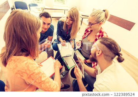 Group of people students working together Group of people students working together 122389524