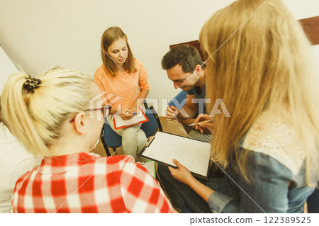 Group of people students working together Group of people students working together 122389525