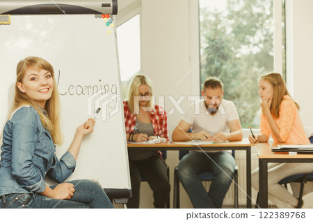 Student girl writting Learning word on whiteboard 122389768
