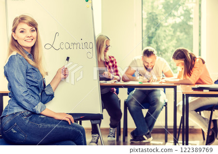 Student girl writting Learning word on whiteboard 122389769