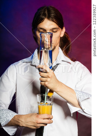 Partying barman makes cocktail. Partying barman makes cocktail. 122389927