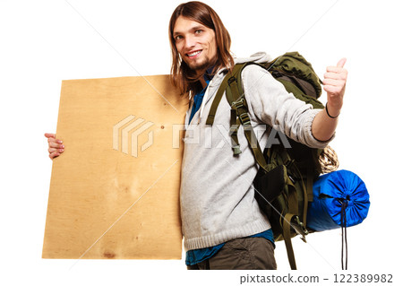 Man hiker backpacker with blank wood copy space ad Man hiker backpacker with blank wood copy space ad 122389982