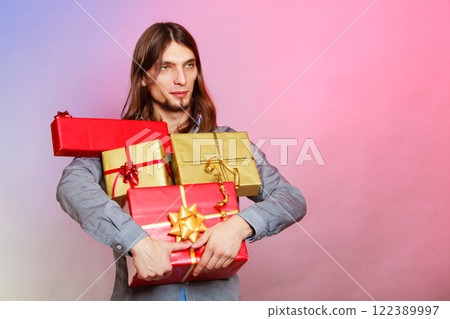 Guy with many presents gift boxes Guy with many presents gift boxes 122389997
