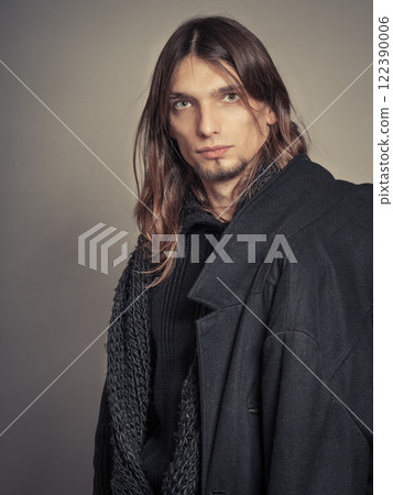 Handsome fashion man portrait wearing black coat. 122390006