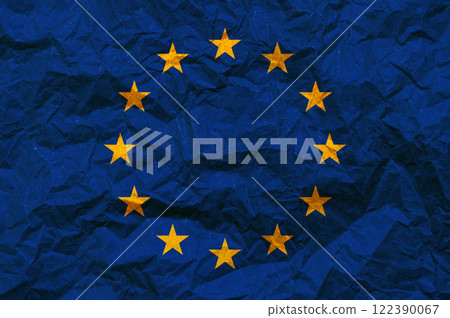 EU flag on paper. The flag of the European Union painted on crumpled craft paper. 122390067