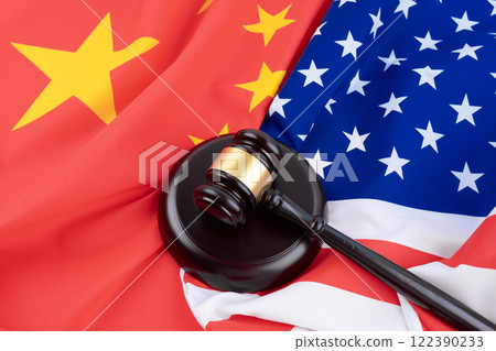 Hammer judge on the background of the American and China flag. Symbol of justice. International law. Hammer judge on the background of the American and China flag. Symbol of justice. International law. 122390233