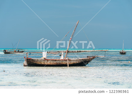 Zanzibar dhows, traditional boats, at anchor Zanzibar dhows, traditional boats, at anchor 122390361