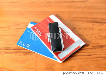 Image of a bankbook and a seal placed on a desk Image of a bankbook and a seal placed on a desk 122391432