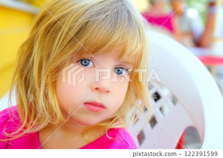 blond little girl portrait looking camera blue eyes 122391599