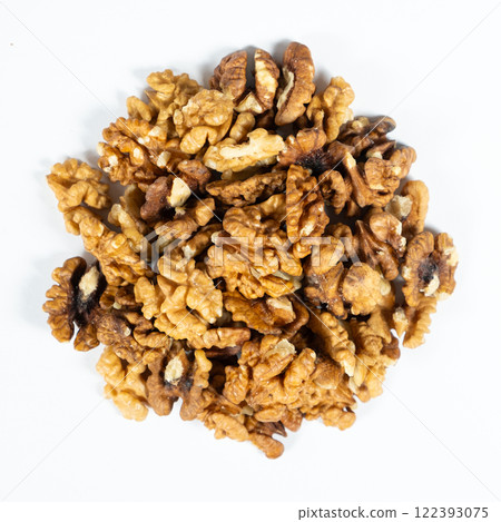 Shelled walnuts on a white background close-up 122393075