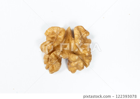 Macro peeled walnut, kernel, white isolate background, top view. Macro peeled walnut, kernel, white isolate background, top view. 122393078