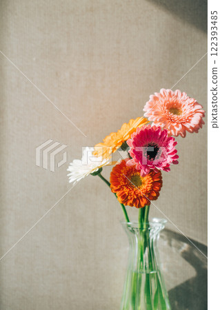 A vase of gerberas on the wall 122393485