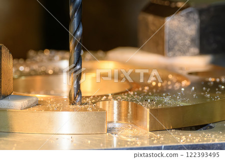 The hole drilling  process on NC milling machine with brass ring parts. 122393495