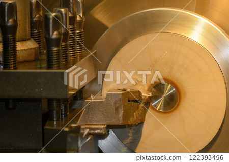 Closeup scene the lathe machine finish cut the metal parts by lathe tools. Closeup scene the lathe machine finish cut the metal parts by lathe tools. 122393496