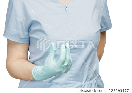 Female physician in gloves holding a syringe with medicine. Female physician in gloves holding a syringe with medicine. 122393577