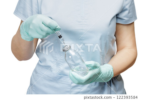 Plastic syringe and bottle for liquid medicine in hands. 122393584