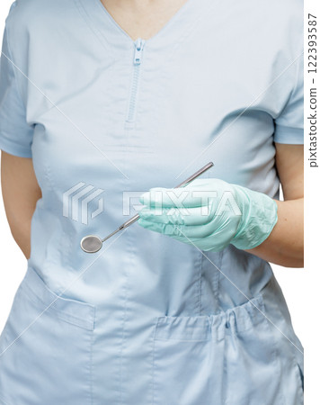 Dentist's hand in glove with mouth mirror. Dentist's hand in glove with mouth mirror. 122393587