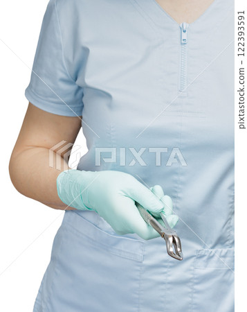 Dentist with dental tongs on the white background 122393591