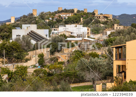 Townscape of Felanitx, Majorca, Mallorca, Balearic Islands, Spain, Europe, with view to a row of old abandoned windmill towers on a hill Townscape of Felanitx, Majorca, Mallorca, Balearic Islands, Spain, Europe, with view to a row of old abandoned windmill towers on a hill 122394039