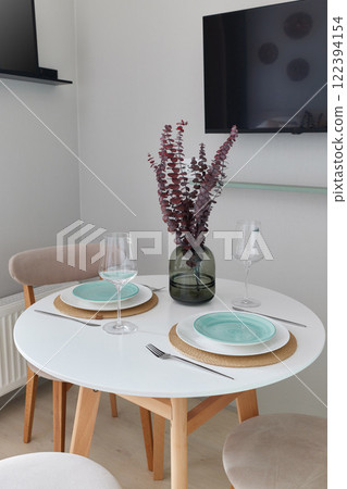 Modern Dining Table Featuring Elegant Decor with a Minimalist and Stylish Design 122394154