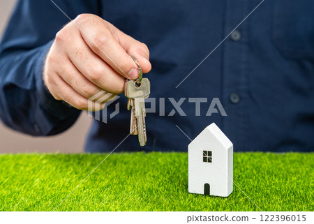 The man holds the keys to the house. Personal achievement. Homeownership continues is key goal for financial security. Buying a home. The man holds the keys to the house. Personal achievement. Homeownership continues is key goal for financial security. Buying a home. 122396015