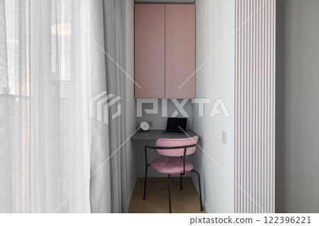 Discover a stylish and cozy modern minimalist home office nook adorned with soft colors Discover a stylish and cozy modern minimalist home office nook adorned with soft colors 122396221