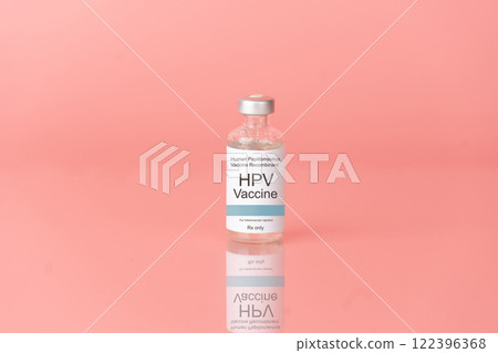 Human papillomavirus (HPV) vaccine bottle on pink background. HPV vaccine protects against certain types of HPV that can cause cervical cancer. 122396368
