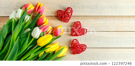 Tulips and heart on wooden background. Valentine's day greeting card concept. Banner format Tulips and heart on wooden background. Valentine's day greeting card concept. Banner format 122397246