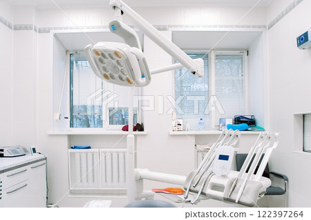 Modern dental equipment in dentist clinic. Dentists tools for treatment and surgery of teeth. Special medical instruments. 122397264