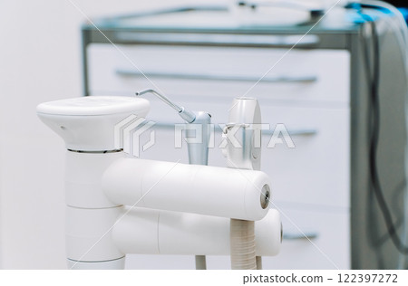 Modern dental equipment in dentist clinic. Dentists tools for treatment and surgery of teeth. Special medical instruments. 122397272