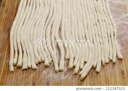 Pici, a Sienese specialty, handmade thick pasta 122397323