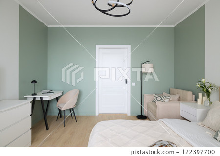 A Modern Minimalist Bedroom Design featuring Soft Green Accent Walls and Chic Decor 122397700