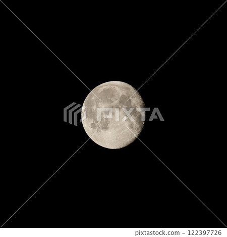 A breathtaking and stunning full moon gracefully illuminates the dark night sky above A breathtaking and stunning full moon gracefully illuminates the dark night sky above 122397726