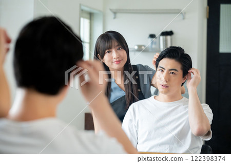 A Japanese man giving hair consultation to a female staff member A Japanese man giving hair consultation to a female staff member 122398374