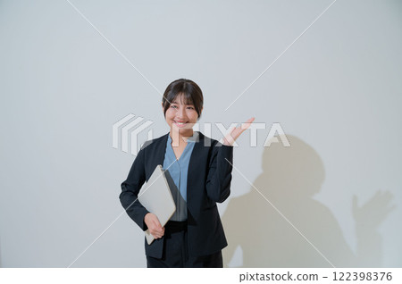A Japanese woman giving a tour 122398376
