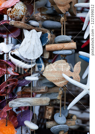 Coastal decorative hanging with seashells, driftwood, and starfish Coastal decorative hanging with seashells, driftwood, and starfish 122399012