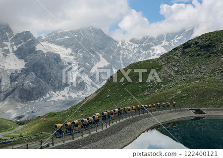 Beautiful view of mountains and a lake, with several mountain cannons placed in the foreground 122400121