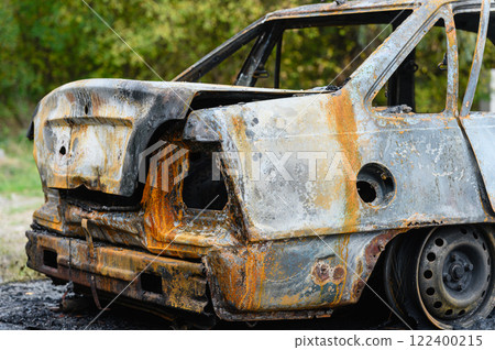 Close-up of the trunk of a burnt-out car. 122400215
