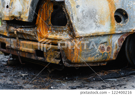 Close-up of the trunk of a burnt-out car. 122400216