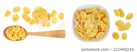 Cornflakes in wooden spoon and ceramic bowl isolated on white background. Top view. Flat lay 122400244