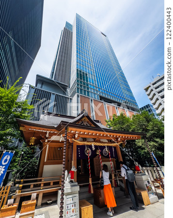 Fukutoku Shrine with view of skyscrapers in business center, Tokyo, Japan 122400443