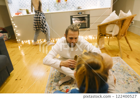 Family Time Enjoying Cozy Indoor Interaction Within a Modern Living Space Environment 122400527