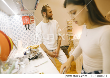 A candid cooking moment captured beautifully in a cozy kitchen, filled with warmth and creativity A candid cooking moment captured beautifully in a cozy kitchen, filled with warmth and creativity 122400661